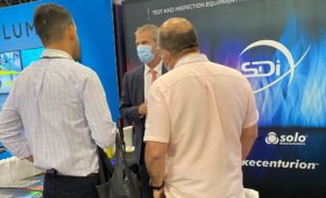 SDi sales representative speaking to customers at the SDi booth at ISC West