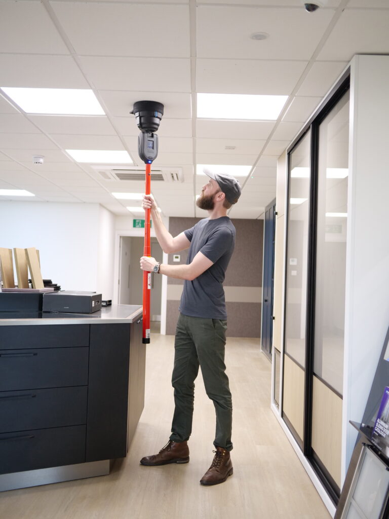 Smoke detector sensitivity testing using the XTR AXIS device during a professional fire alarm inspection